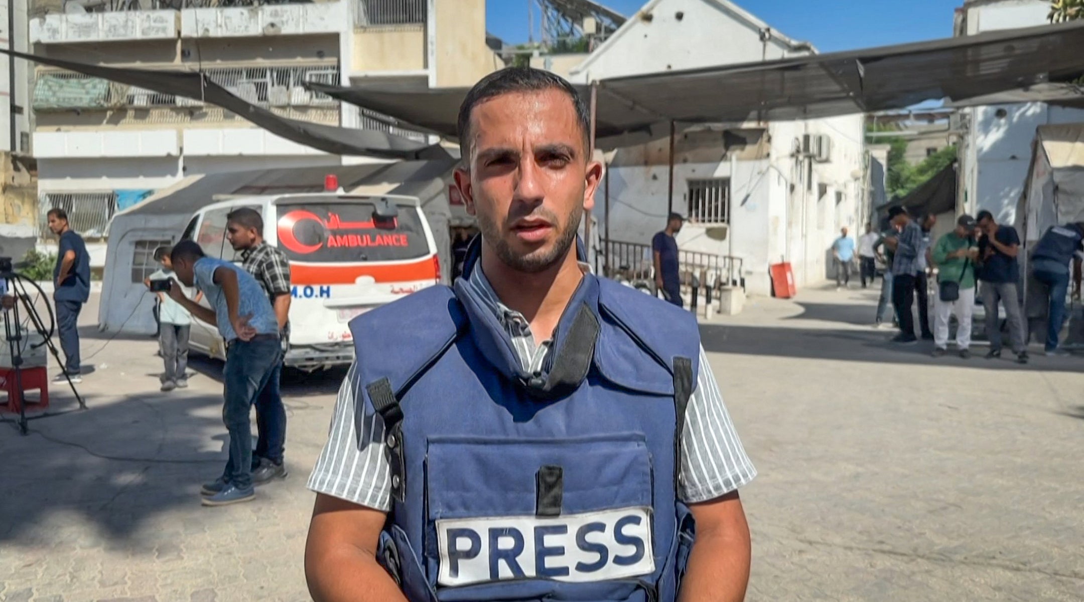 A photo of Anas al-Sharif in a "Press" vest.